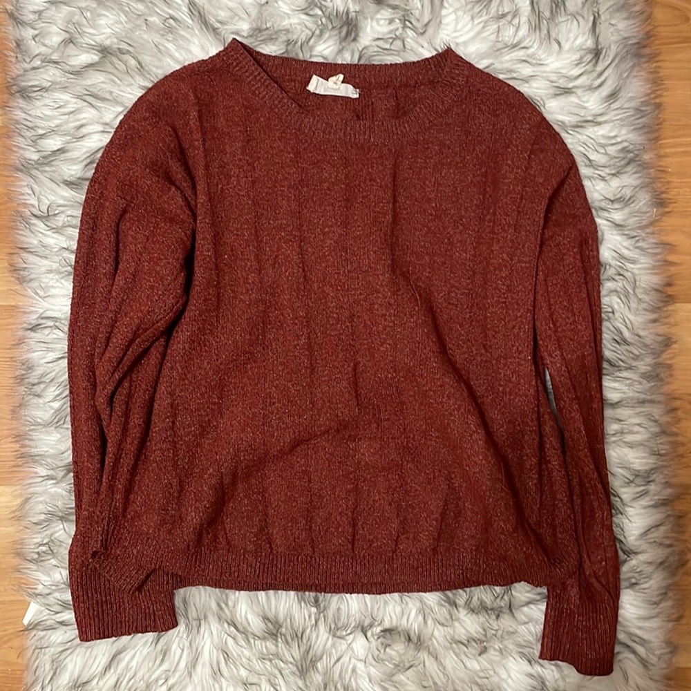 Red sweater, with cute cross design on the back